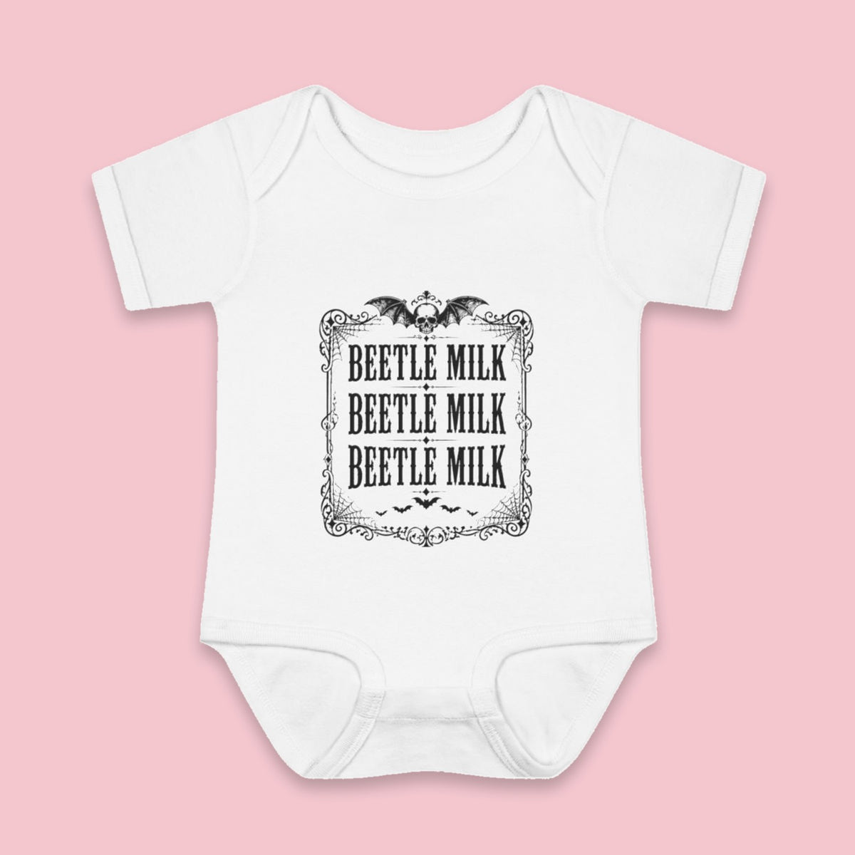 Beetle Milk onesie – Flat on pink background