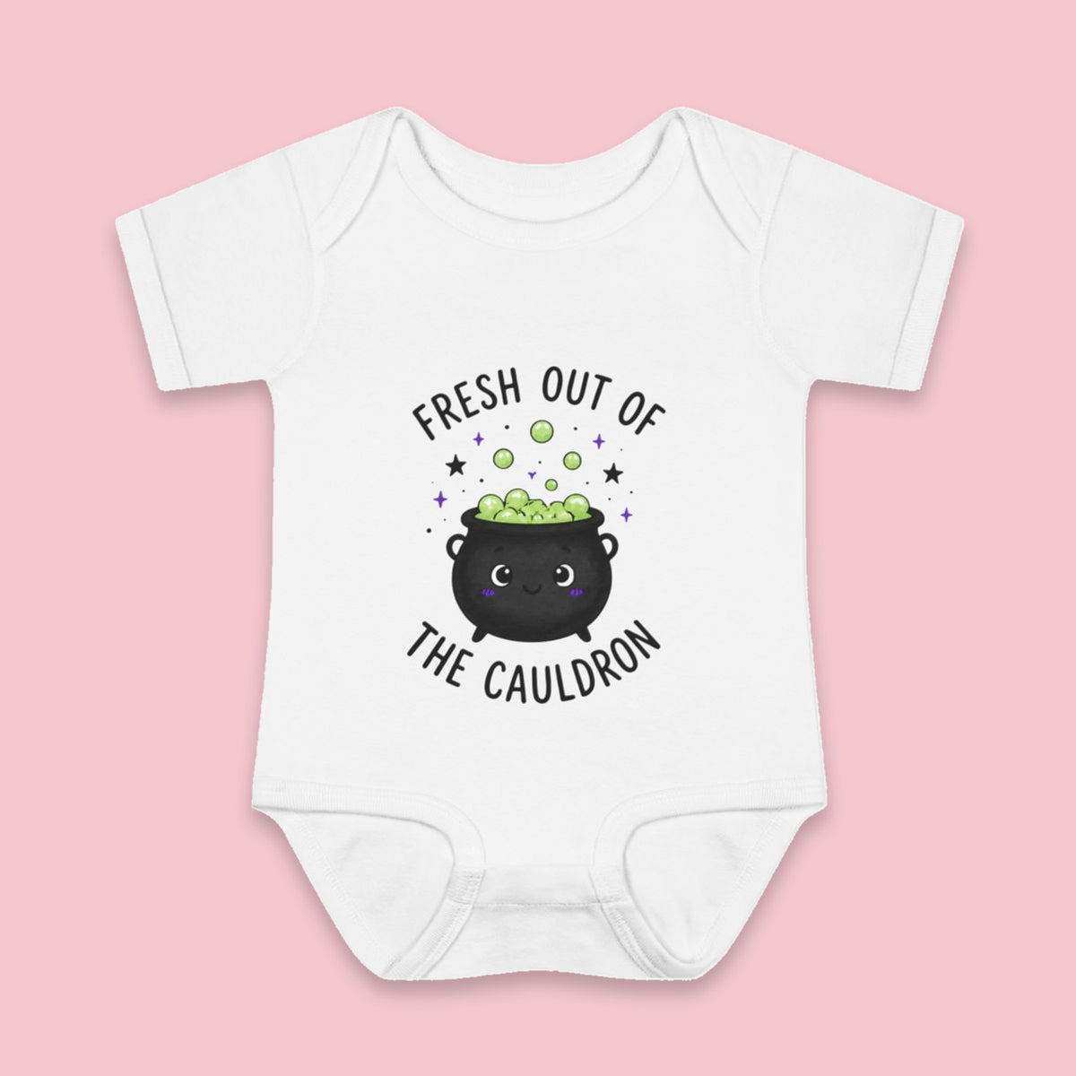 Fresh Out of the Cauldron onesie – Flat on pink background