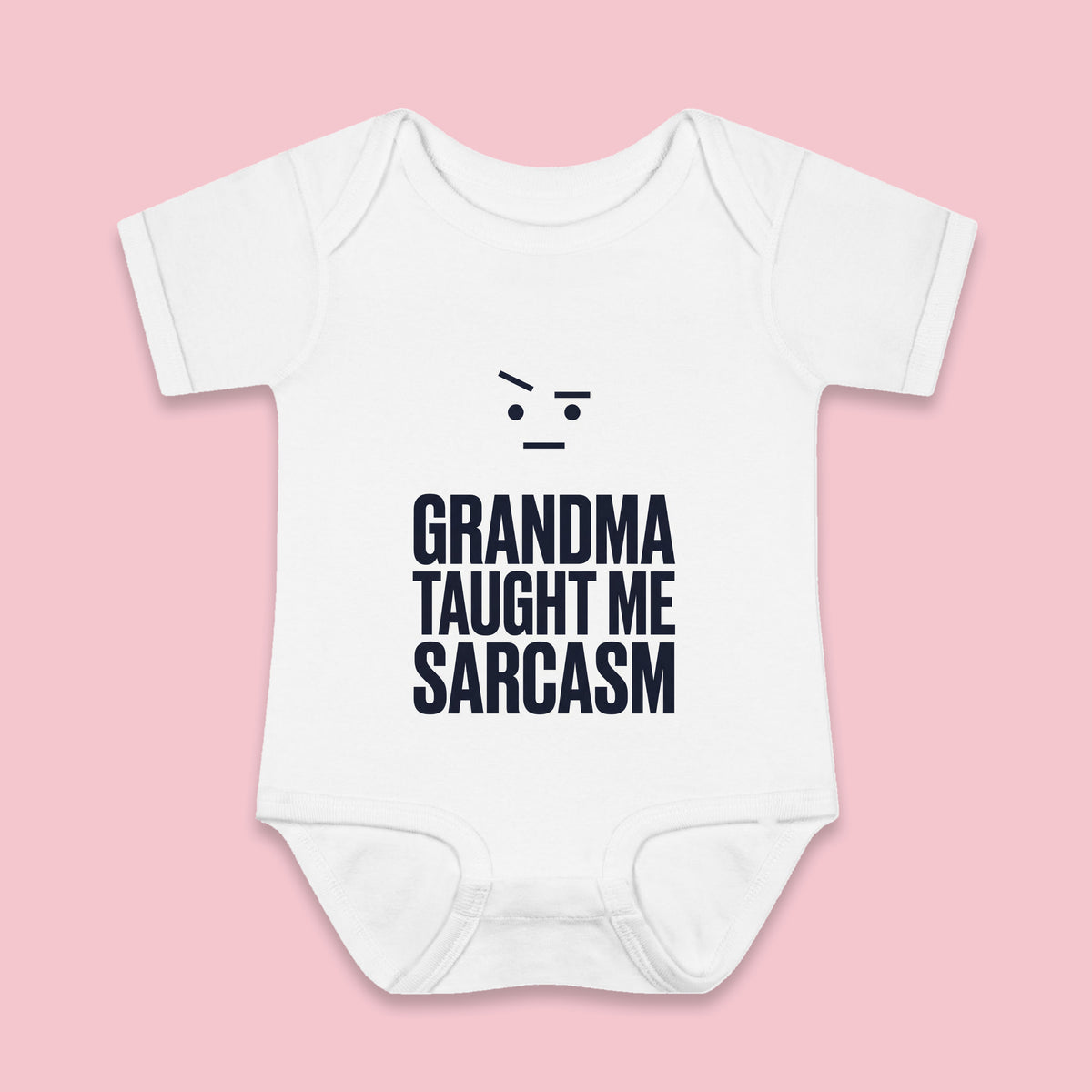 Grandma Taught Me Sarcasm onesie – Flat on pink background