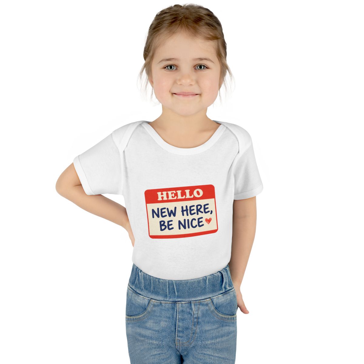 New Here, Be Nice onesie – Worn by a baby