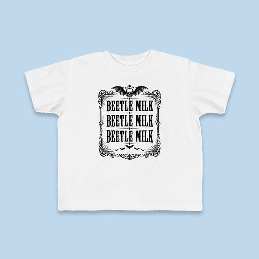 Beetle Milk toddler tee – Flat on blue background