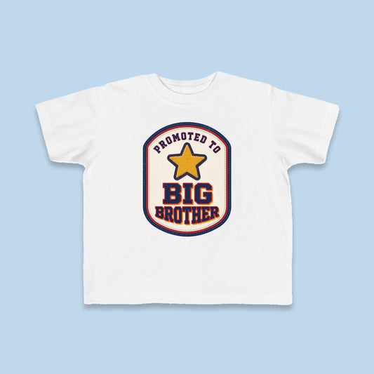Promoted to Big Brother toddler tee – Flat on blue background