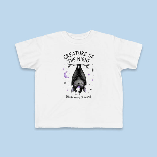 Creature of the Night (Feeds Every 3 Hours) toddler tee – Flat on blue background
