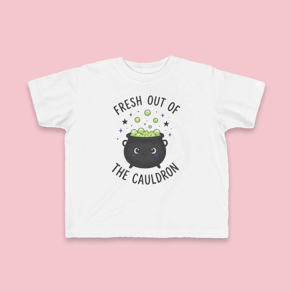 Fresh Out of the Cauldron toddler tee – Flat on pink background