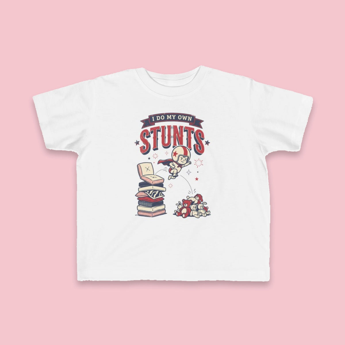 I Do My Own Stunts toddler tee – Flat on pink background