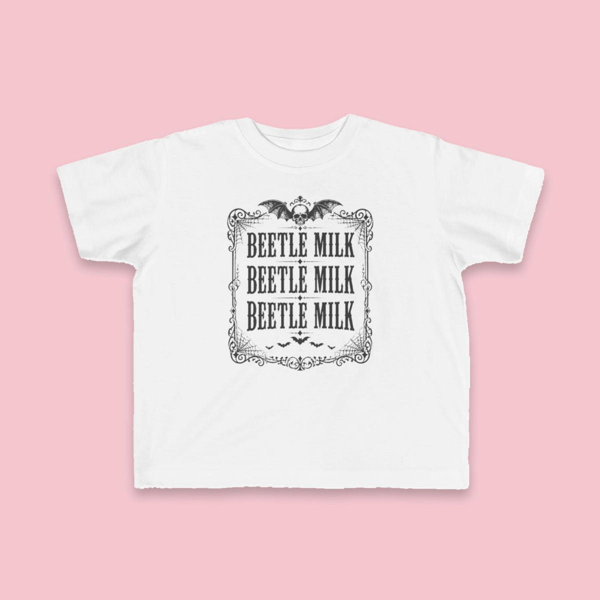 Beetle Milk toddler tee – Flat on pink background