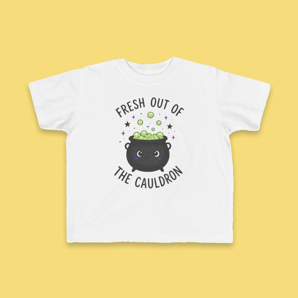 Fresh Out of the Cauldron toddler tee – Flat on yellow background